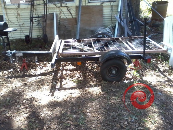 junk trailer, with twin bed frame for size comparison.jpg