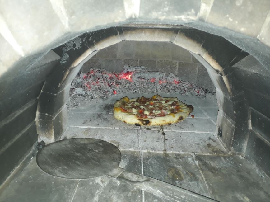 meat lovers pizza in the wood oven.JPG