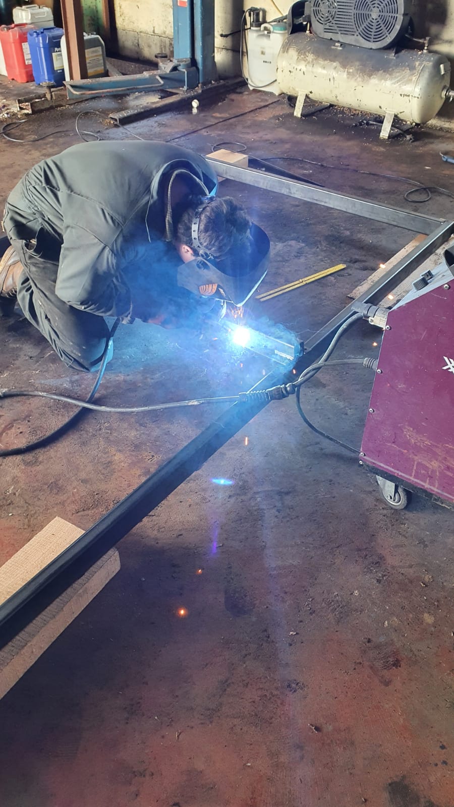 MIG welding the frame.jpeg