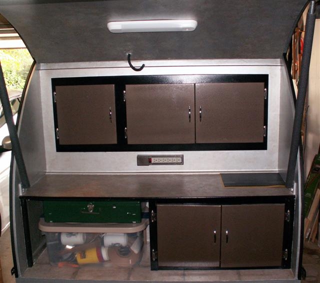 Galley with plastic storage box & stowed Coleman 413F