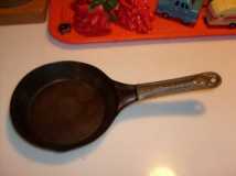 Small old steel skillet