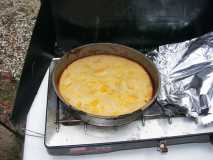 Dutch oven peach cobbler, cooked in pie pan