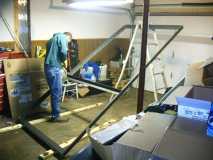 My cousin Ronnie putting center cross beam on frame