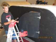 My son Casey painting the doors to seal them