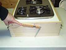 spring loaded stove drawer stop