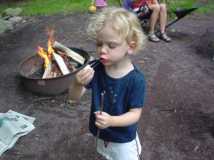 Gracie enjoying her first roasted marshmallow.