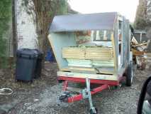 Front picture of trailer before the last few panels where placed to complete the shell frame before the second layer of insulation is installed.