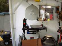 Bandsaw in tent.