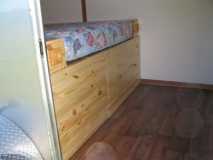 Front of the drawers under the bed