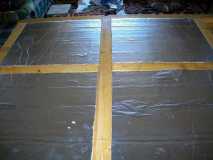 (0161) I used a hacksaw blade and cut pieces 1/8" larger than my measurements. I put PL construction adhesive on the underside of the floor and pressed the insulation into the cavity. It has a tight interference fit.