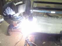 Buddy Mike welding in the belly pan.
