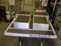 Floor structure with storage boxes attached ready to be turned over