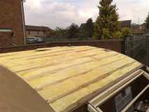 Insulation being installed prior to roof skin being attached