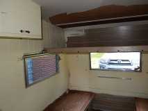 Passenger side rear, bench, bunk, cabinet