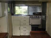 Original kitchen, stove, cabinets. New fridge