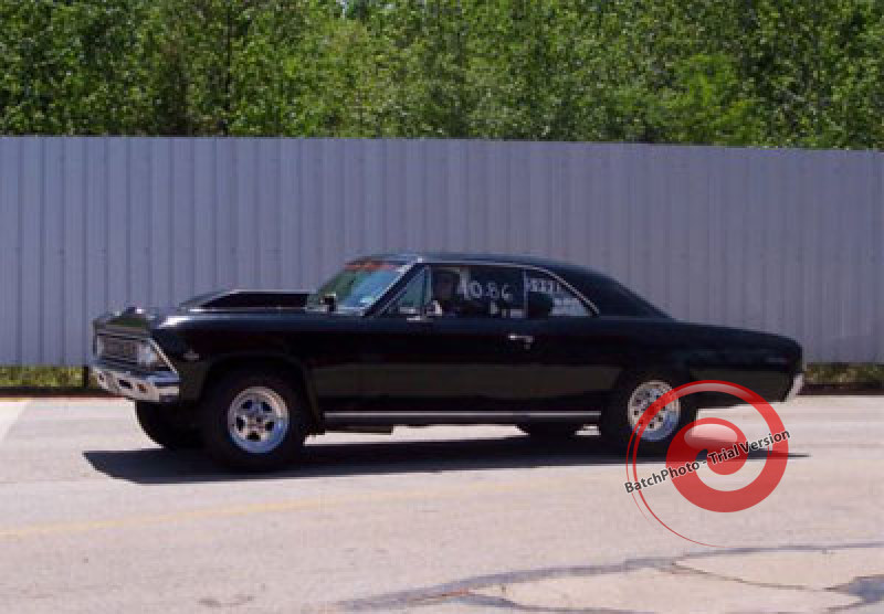 working on its' '66 Malibu.jpg