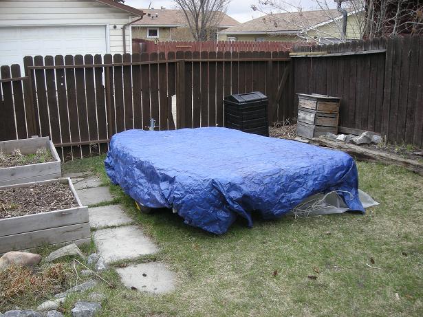 trailer under cover.JPG