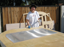 Sue glassing a side panel