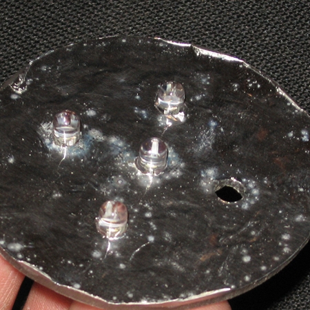 LED disc with one LED removed.