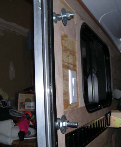 Inside of trailer door showing the bolts.