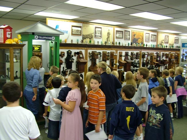 Our Traveling Museum with students checking it out.