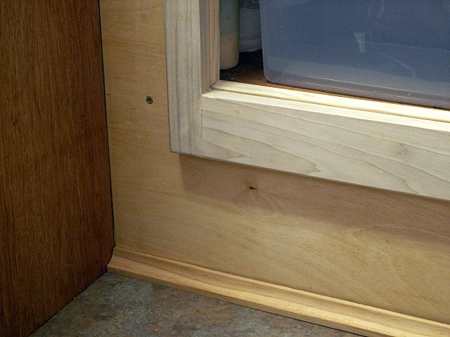 Close up of detail in face frame and cabinet top.