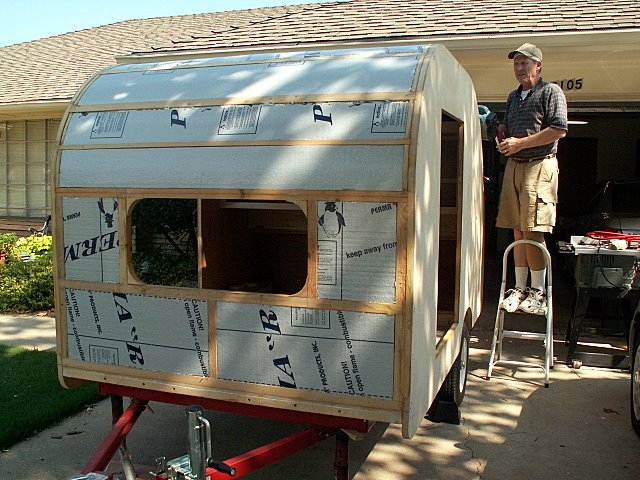 Belt sanding the top of the walls to smooth things out before attaching the roof skin