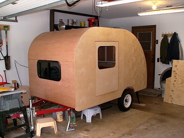 First layer of 1/8" ply is on the trailer. Layer one is luaun.  Second layer to be birch.