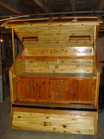 GALLEY AREA WITH TAILGATE DOWN/CAN ALSO BE FLAT FOR COFFEE TABLE .