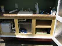 Galley cabinet faces and shelves installed.