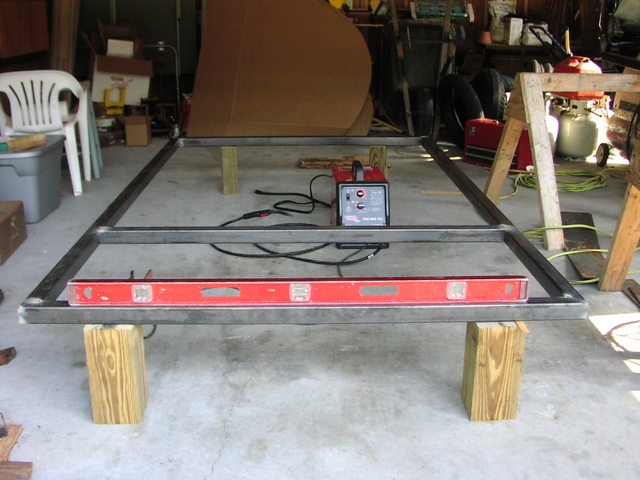 07/14/07 finally got started.  Cut steel tube, squared it up and spotwelded on garage floor.  Set it up on blocks, leveled side to side and burned it in.