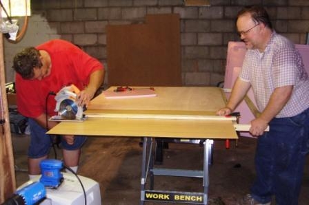 David and Al cutting wood