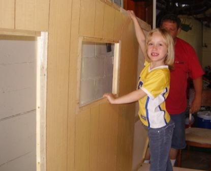 Daughter helps hold the wall