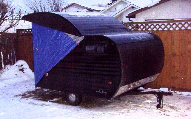 Removed the rotted canvas and cut up an old tent for the sides