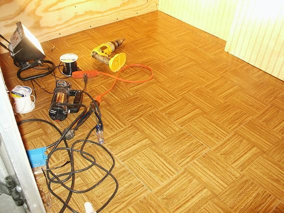 Parquet tile installed in cargo conversion