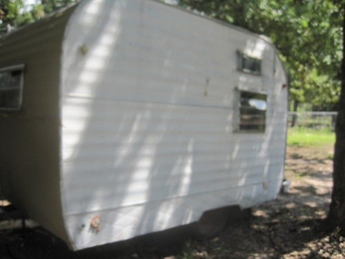 Driver's side of mystery camper