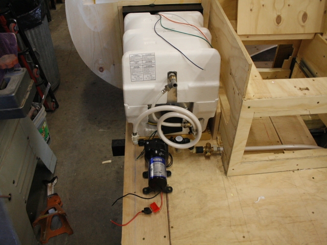There will be a suport wall between the heater and the bench that will be used as cabinets and storage