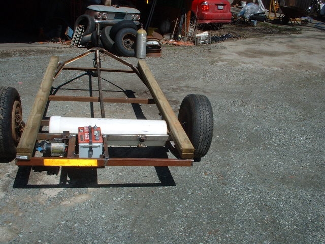 210 trailer frame with 12 gal water tank ,water pump. battery. all will be under the floor