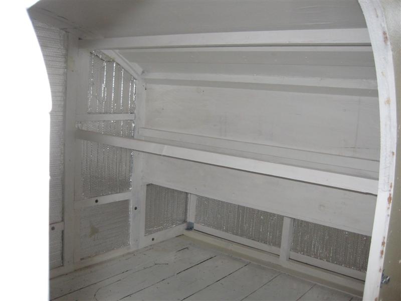 Inside rear with shelf/cabinet area.