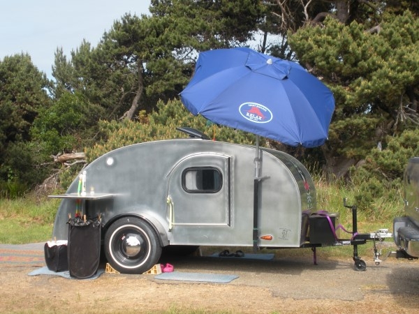 Small table extension as umbrella holder