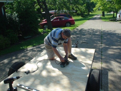 Barb sanding the floor