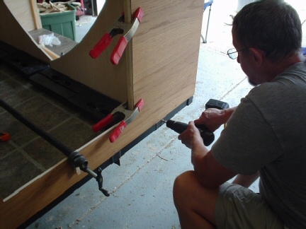 After walls are glued, Bills adds the screws. Very exciting!