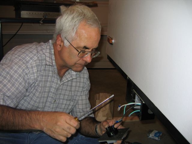 Hooking up shore power plug.