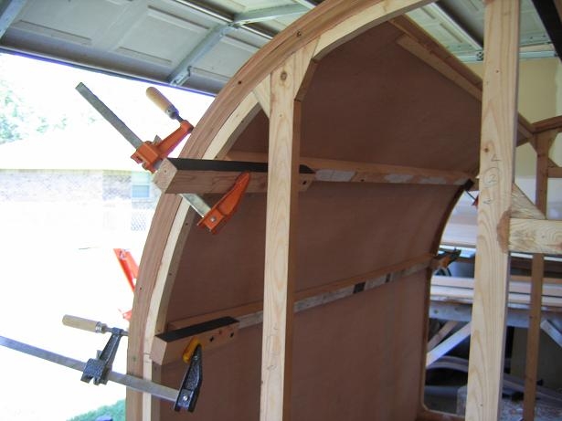 Bending luan using boards and bar clamps.