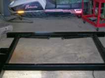 Spare bed frame - makes a nice set of rear levelers that swing up & down