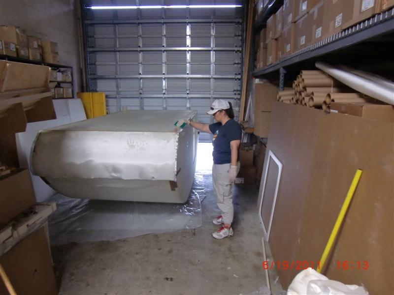 Applying fiberglass on the bottom.