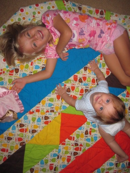 Titus and Emilia on quilt