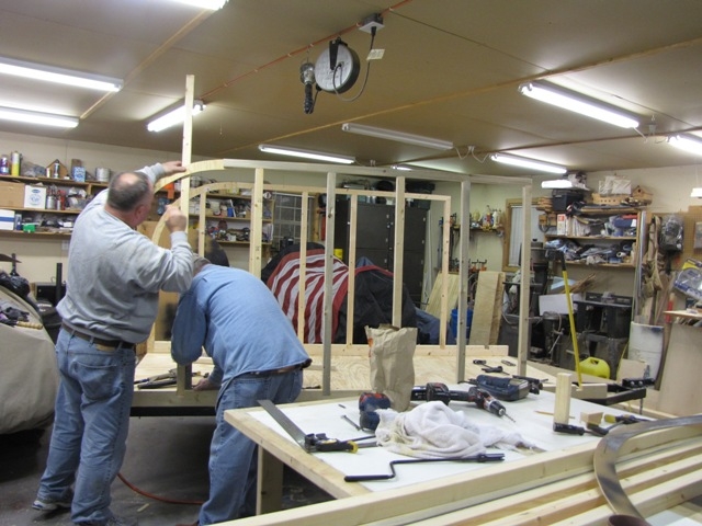 hand fitting a piece of the hatch radius