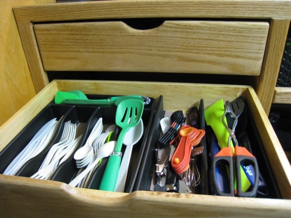 Lower galley drawer filled with camping gear -IMG 2591