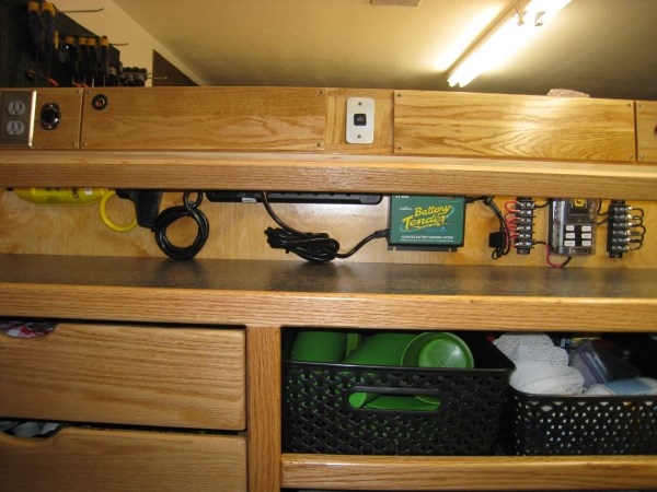 Electrical panel layout above galley upper shelf - IMG 2599